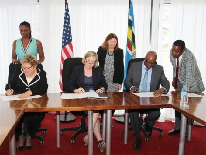 EAC Secretary General Amb. Liberat Mfumekeko (seated right) signs the five-year EAC-USAID Regional Development Objective Grant Agreement together with Ms. Karen Freeman (USAID Mission Director for East Africa (left) and Ms. Virginia Blaser, the Chargé d’Affaires of the US Embassy in Tanzania. Photo: East African Community