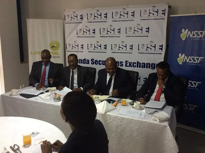 L-R: Stanbic's Edwin Mucai, NSSF's Richard Byarugaba, Umeme's Selestino Babungi and Paul Bwiso, the chief executive of the Uganda Securities Exchange at the USE offices in Kampala. Photo: Uganda Business News