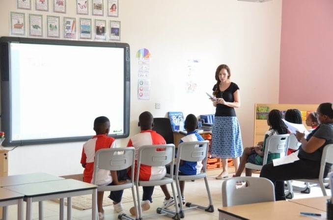 A teacher and pupils in a classroom