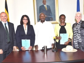 Officials and Uganda's president after the signing of a contract with the Albertine Graben Refinery Consortium to finance and construct Uganda’s first oil refinery