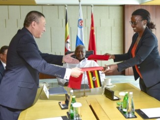 Uganda National Oil Company chief executive, Josephine Wapakabulo with Cnooc officials in Beijing, China