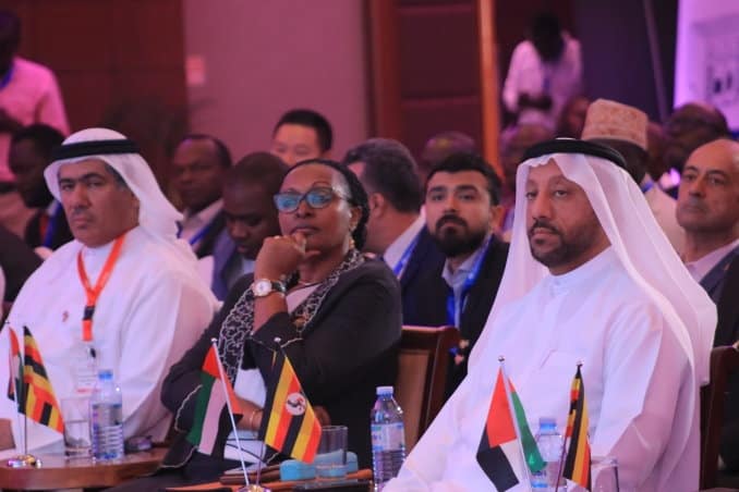 Three officials of the Uganda National Chamber of Commerce and Industry and the Sharjah Chamber of Commerce and Industry at a business forum