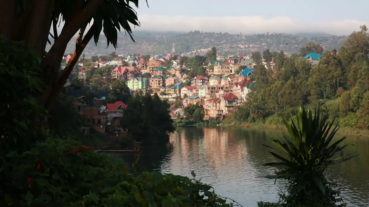 Houses can be seen in the distance on the other side of Lake Kivu in Bukavu, Democratic Republic of Congo. It is a verdant, lovely scene that belies the country's turbulent recent history, particularly in this region — the eastern part close to Rwanda and Uganda.