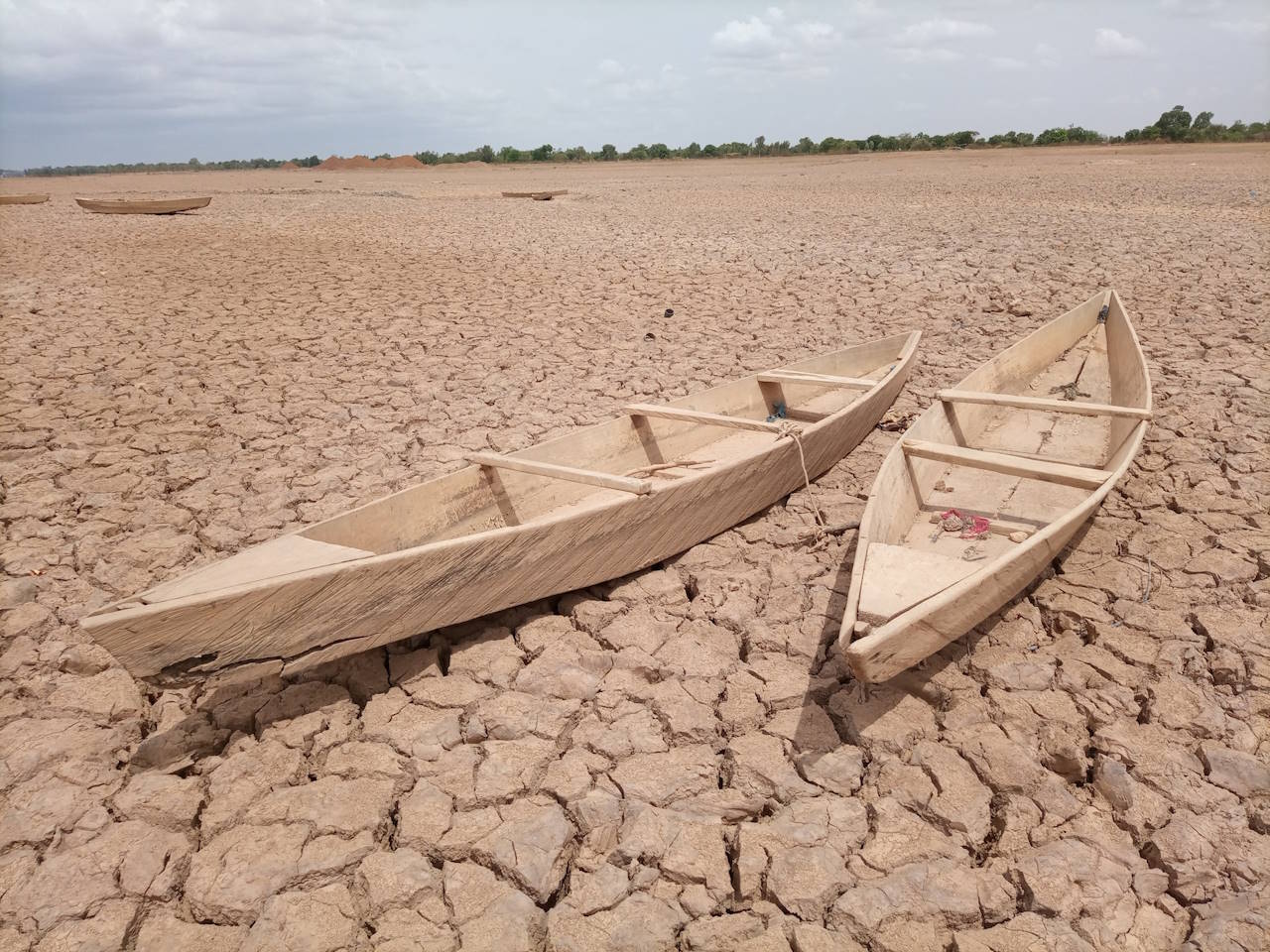 Canoes on a parched wetland in Burkina Faso