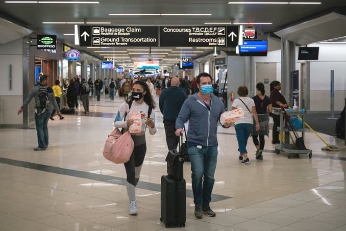 Coronavirus: Flyers at an American airport wearing facemasks