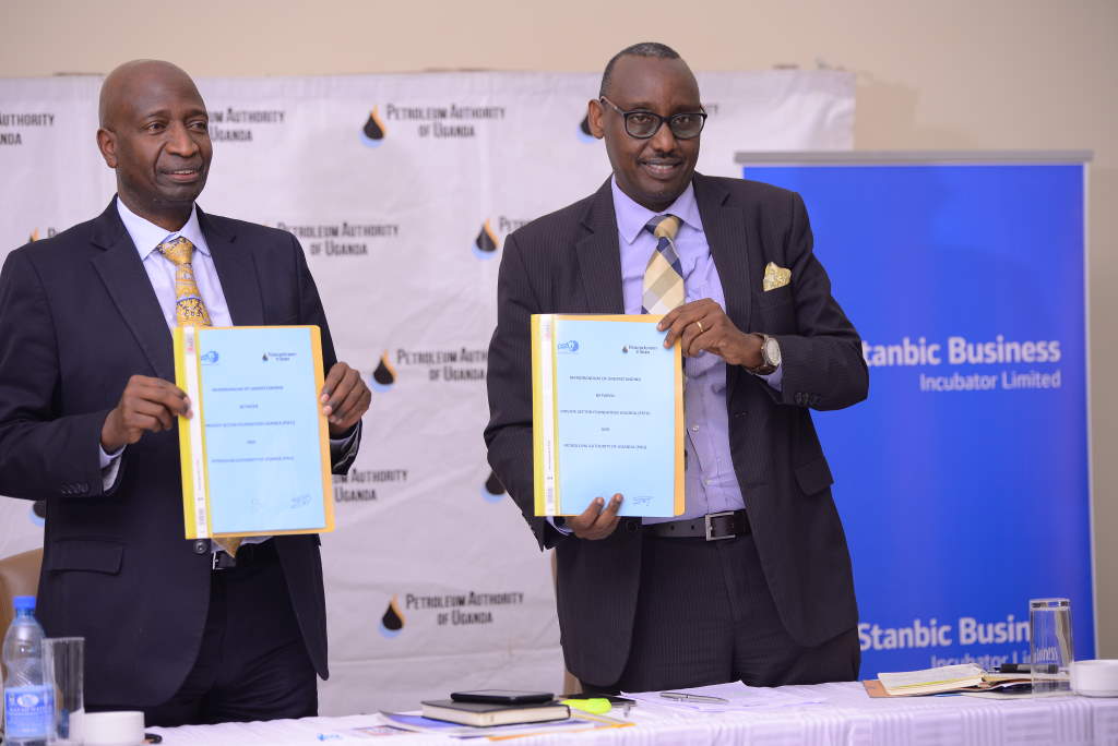 Two male executives after signing a memorandum of understanding