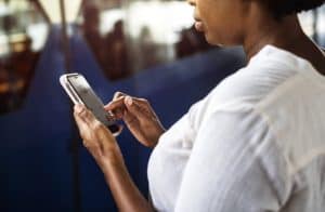 A female person using a smart phone