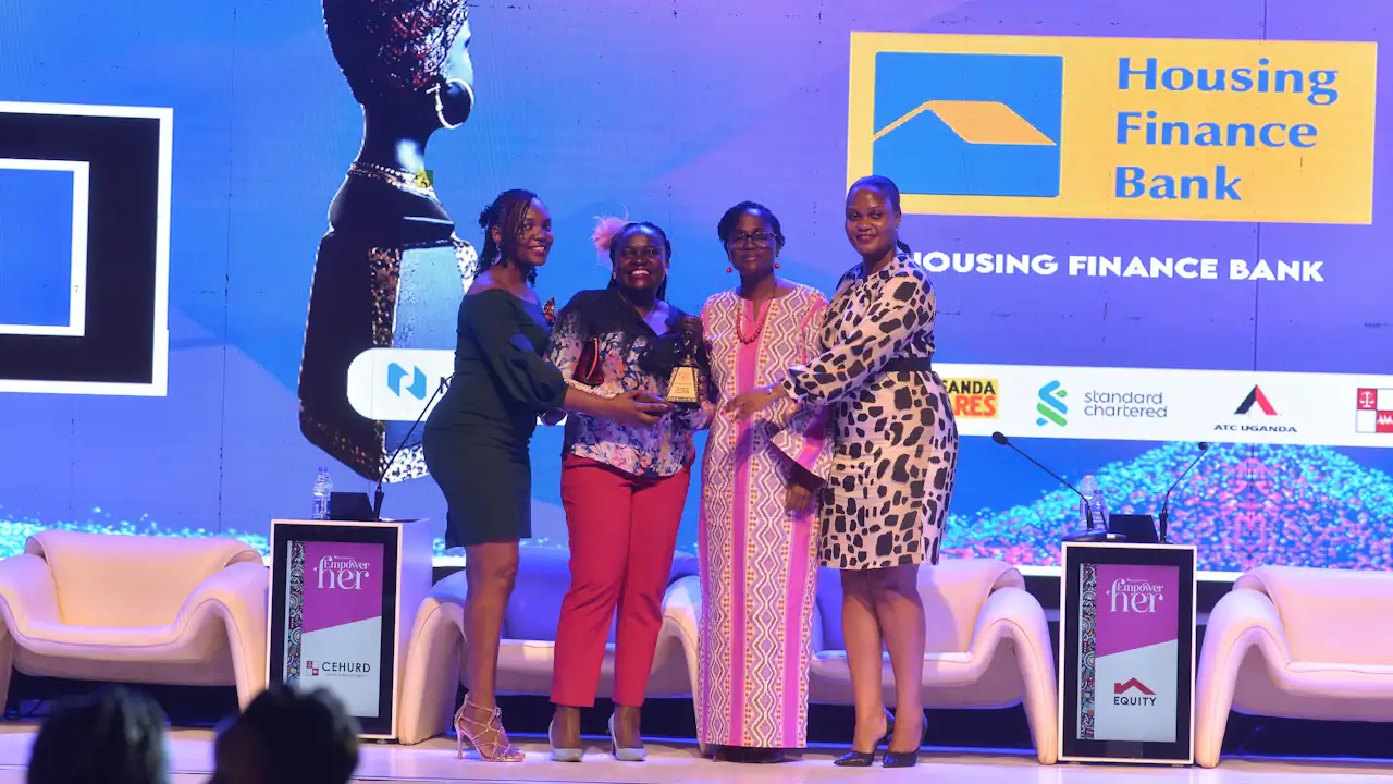 Three women on stage at an awards ceremony holding a trophy. Housing Finance Bank has won two awards for its commitment to gender equality in the workplace at the 2024 edition of the Empower Her initiative, organised by Nation Media Group and KPMG under the theme “Achieving an Equal Future”. The awards recognise the work of organisations that advance women through structural and systemic measures and the application of strategic options. The bank was recognised in the “Empower Her” and “Woman of the Future” categories for its significant representation of women in leadership and decision-making roles, and for its unique and impactful initiatives to promote gender balance in the workplace.