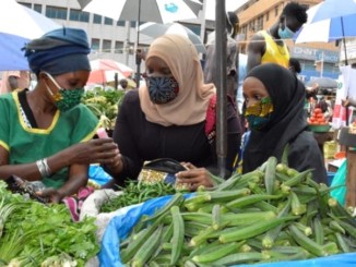 Market vendors in Uganda wearing masks to protect against Covid-19 coronavirus