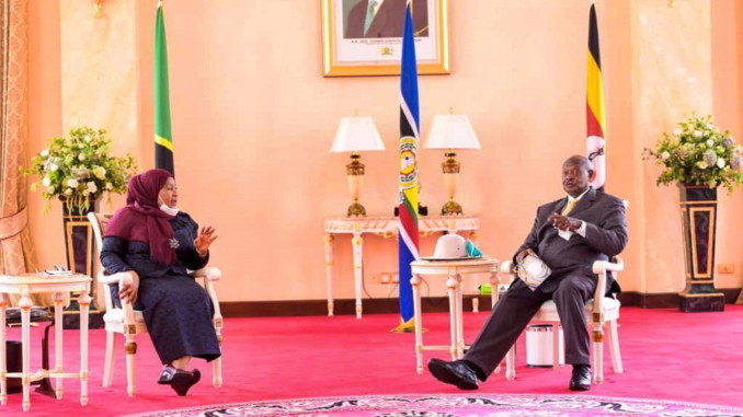 Presidents Suluhu Hassan and Yoweri Museveni, seated