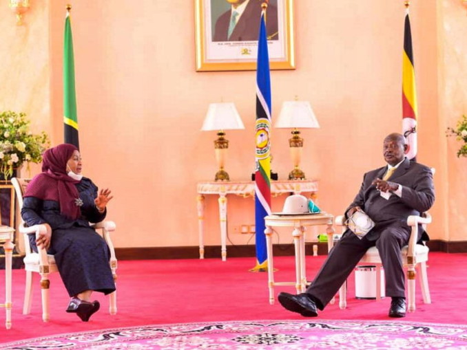 Presidents Suluhu Hassan and Yoweri Museveni, seated