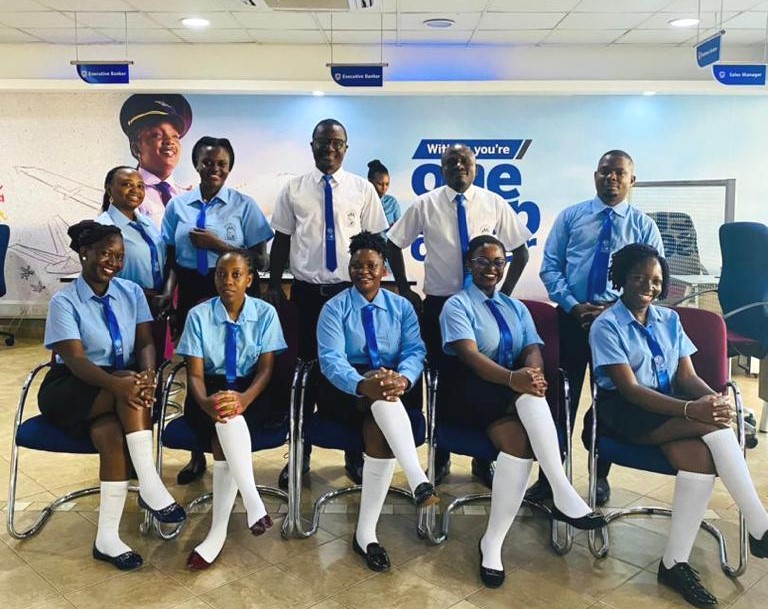 Ten adults wearing school uniform for a back-to-school promotion