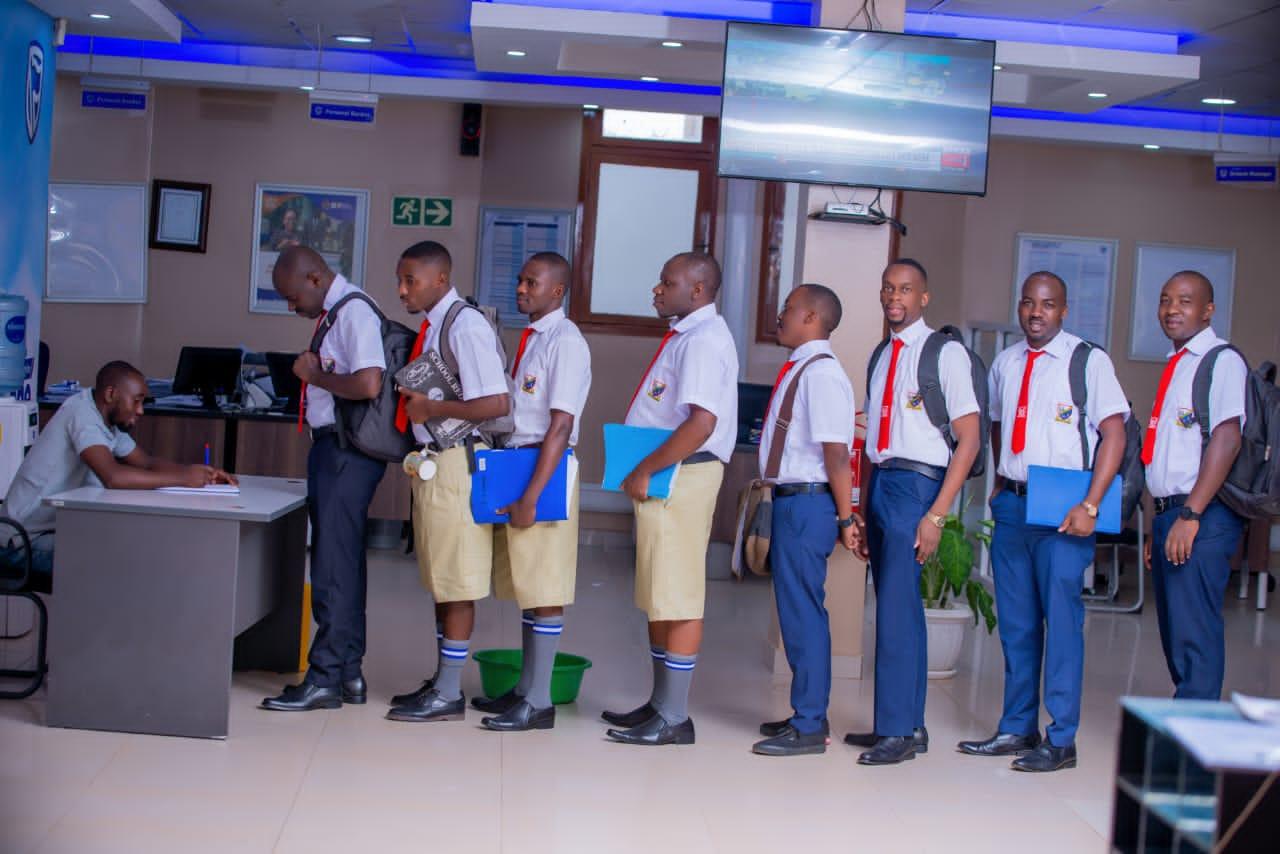 A queue of adults in school uniform as part of a back-to-school promotion