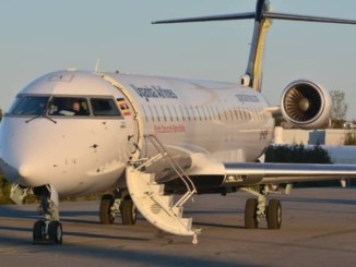 A passenger airplane packed at an airport