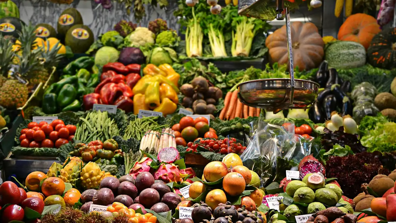 Vegetables and fruit on a stall at Mercat de la Boqueria, Barcelona.