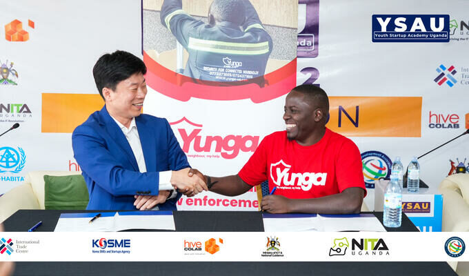 Korean investor and Ugandan founder shake hands