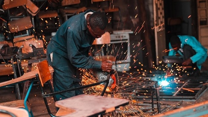 Men operating welding machinery