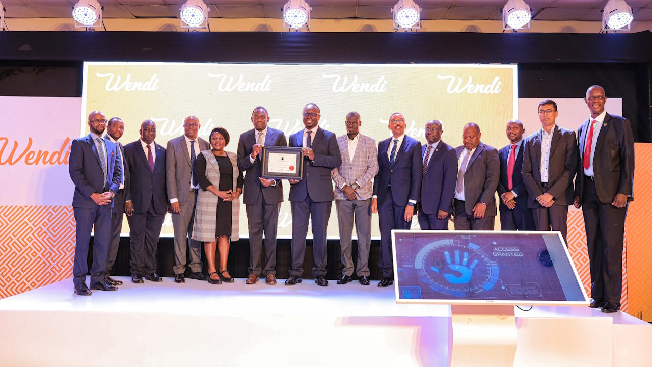 Michael Atingi-Ego, deputy governor Bank of Uganda, stands with other officials at the launch of PostBank's Wendi mobile platform, 1 November 2023