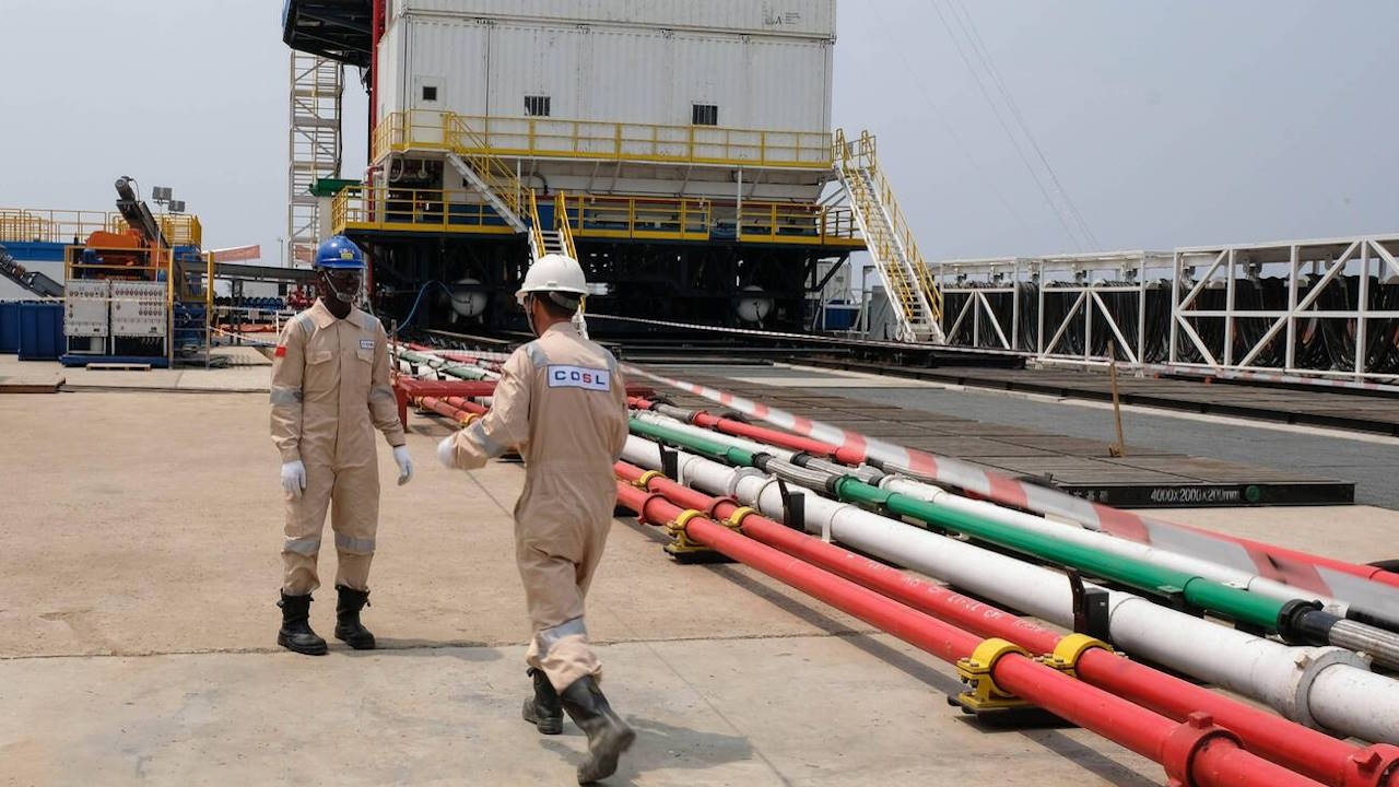 Workers at the Kingfisher Oil Field in Kikuube, Uganda, on 24 January, 2023. Ugandan President Yoweri Museveni launched the drilling process at the Kingfisher Oil Field, operated by the Chinese oil giant China National Offshore Oil Corporation Cnooc.